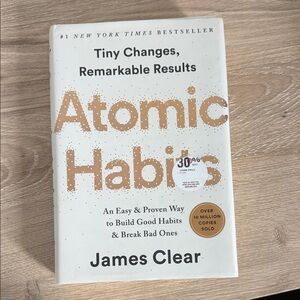 Atomic Habits by James Clear — White & Gold Cover